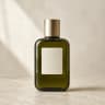Starting image: Olive-green bottle with a gold cap on a warm neutral background